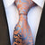 Witte stropdas met oranje paisleypatroon