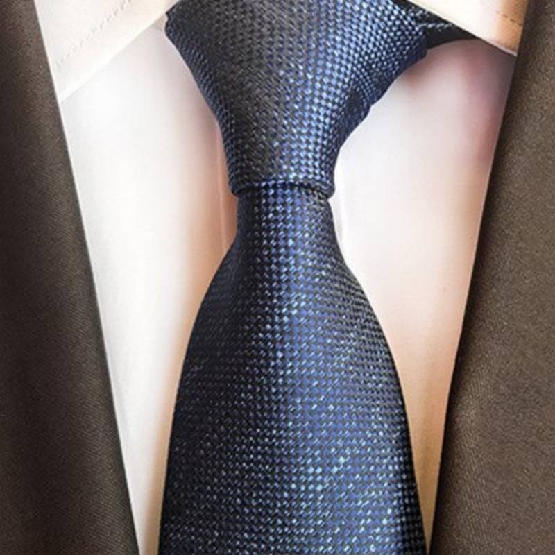Marineblauwe stropdas met lichtblauwe stippen