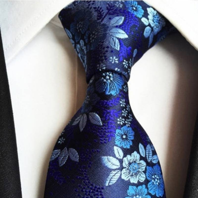 Blauwe stropdas met witte bloemen