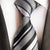 Grijze stropdas met zwarte en witte strepen