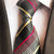 Grijze stropdas met roze, gele en witte strepen