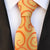 Gele stropdas met oranje patronen