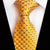 Gele stropdas met zwarte stippen
