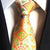 Oranje stropdas met groene patronen
