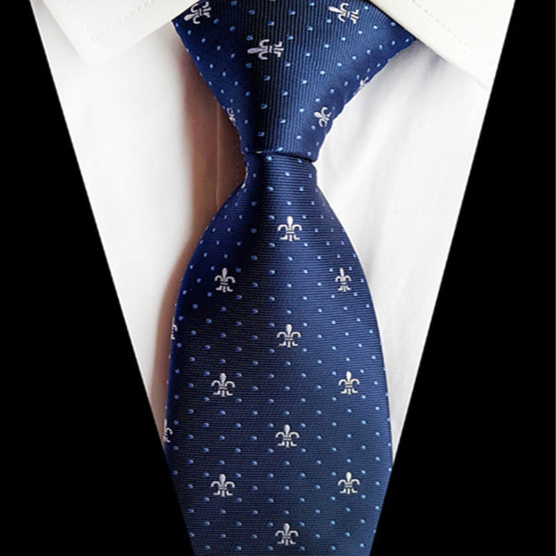Donkerblauwe stropdas met blauwe stippen en wit patroon